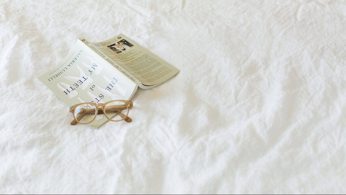 Book glasses on linen