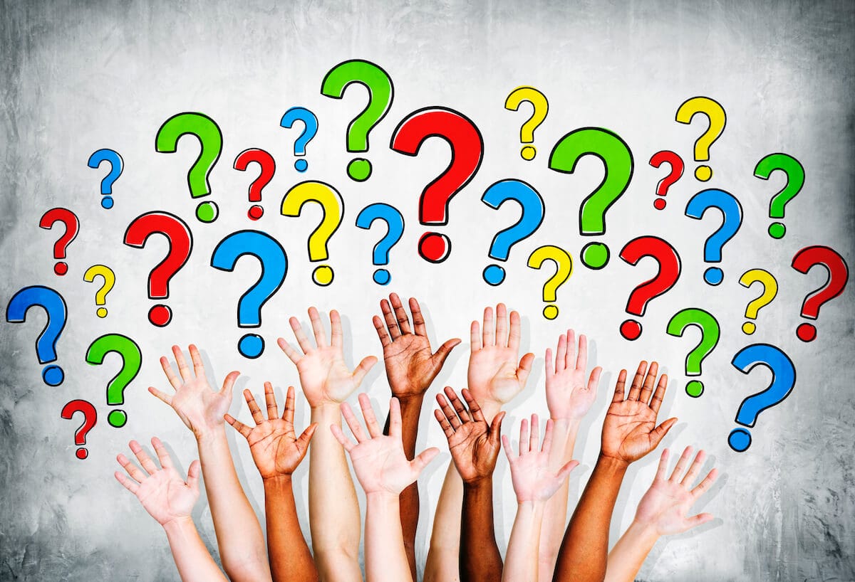 Multi Ethinic Arms Outstretched To Ask Questions