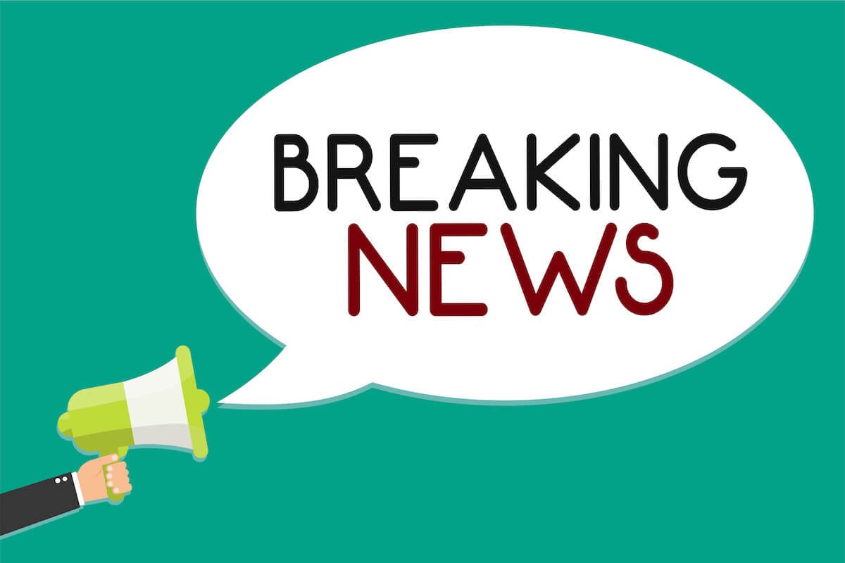 Handwriting text writing Breaking News. Concept meaning Special Report Announcement Happening Current Issue Flashnews Man holding megaphone loudspeaker speech bubble message speaking loud.