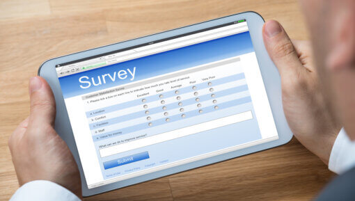 Businessman Giving Online Survey On Digital Tablet