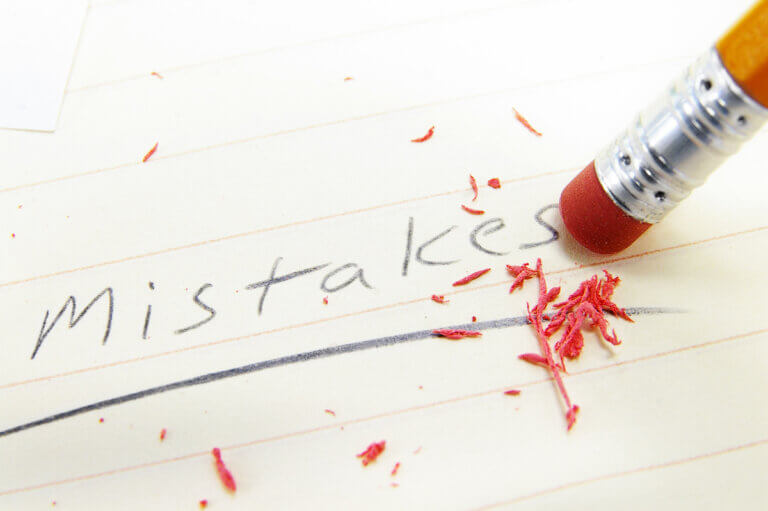 Mistakes written in pencil and being erased