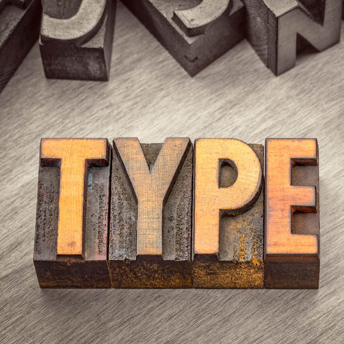 type word abstract in vintage letterpress wood type printing blocks, color combined with black and white image
