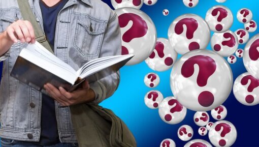A student holding a book with question mark bubbles behind him.