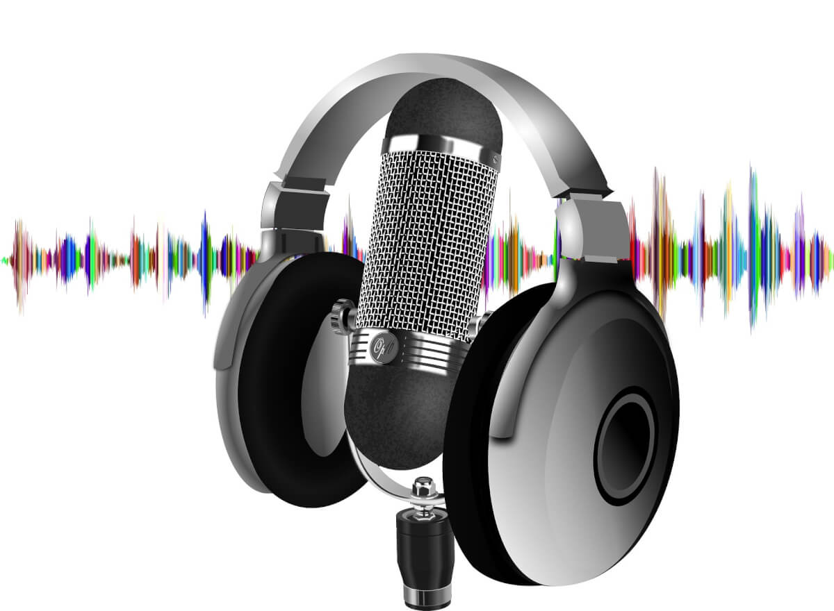 Headphones resting on a microphone in front of a colorful soundwave.