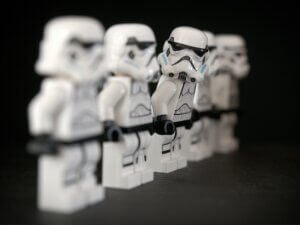Lego Stormtroopers standing in a line.