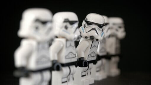 Lego Stormtroopers standing in a line.