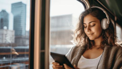 woman-reading-on-a-bus-with-headphones